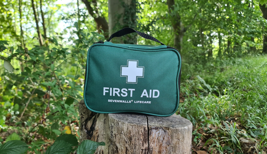 Inside view of green 210 PCS first aid kit bag with compartments and labelled medical supplies