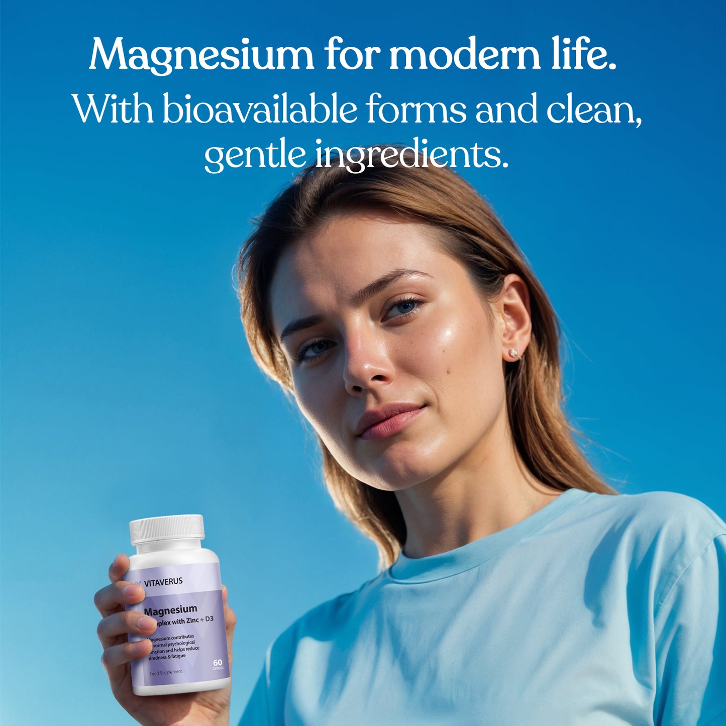 Woman holding a supplement bottle with text about magnesium on a blue background