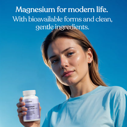 Woman holding a supplement bottle with text about magnesium on a blue background