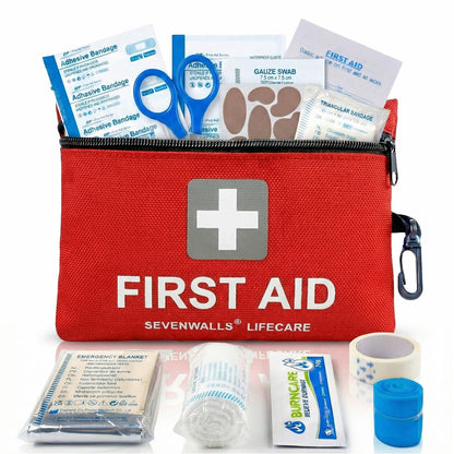 Red first aid kit with contents displayed on a white background
